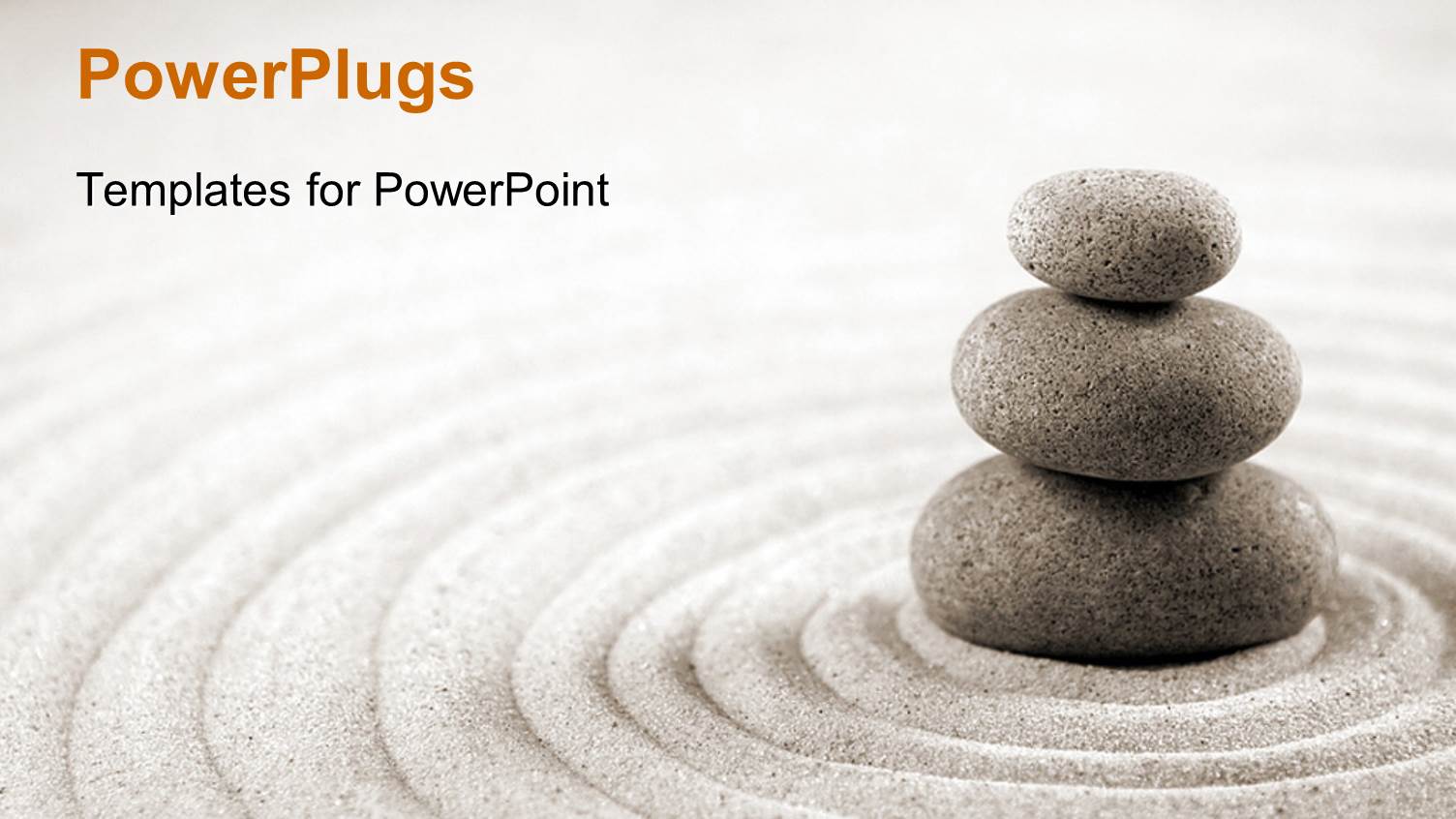 Three Stacked Stones on Raked Sand