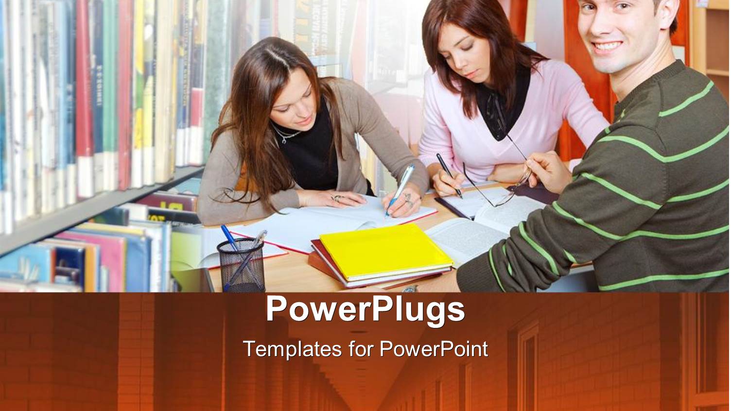 Three Students in Study Group Inside Library with Boy Smiling
