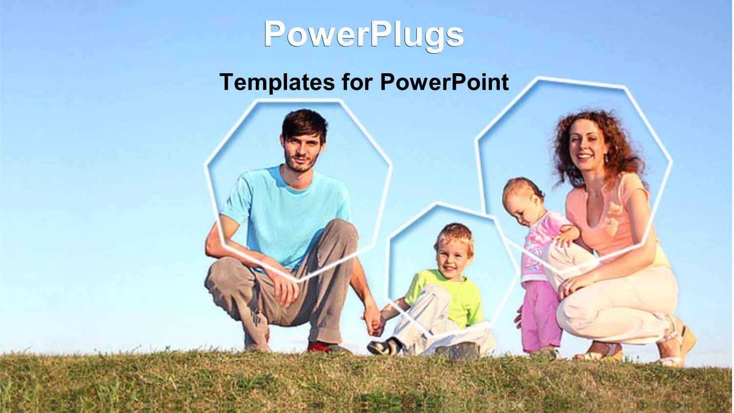 Two Adults with Two Children Kneeling on a Grass