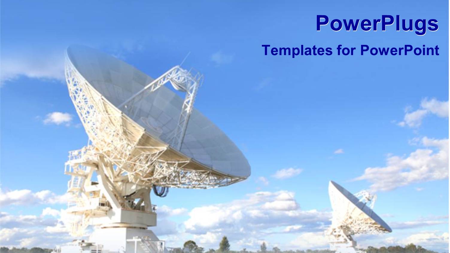 Two huge White Satellite Dishes on Field Under Blue Sky