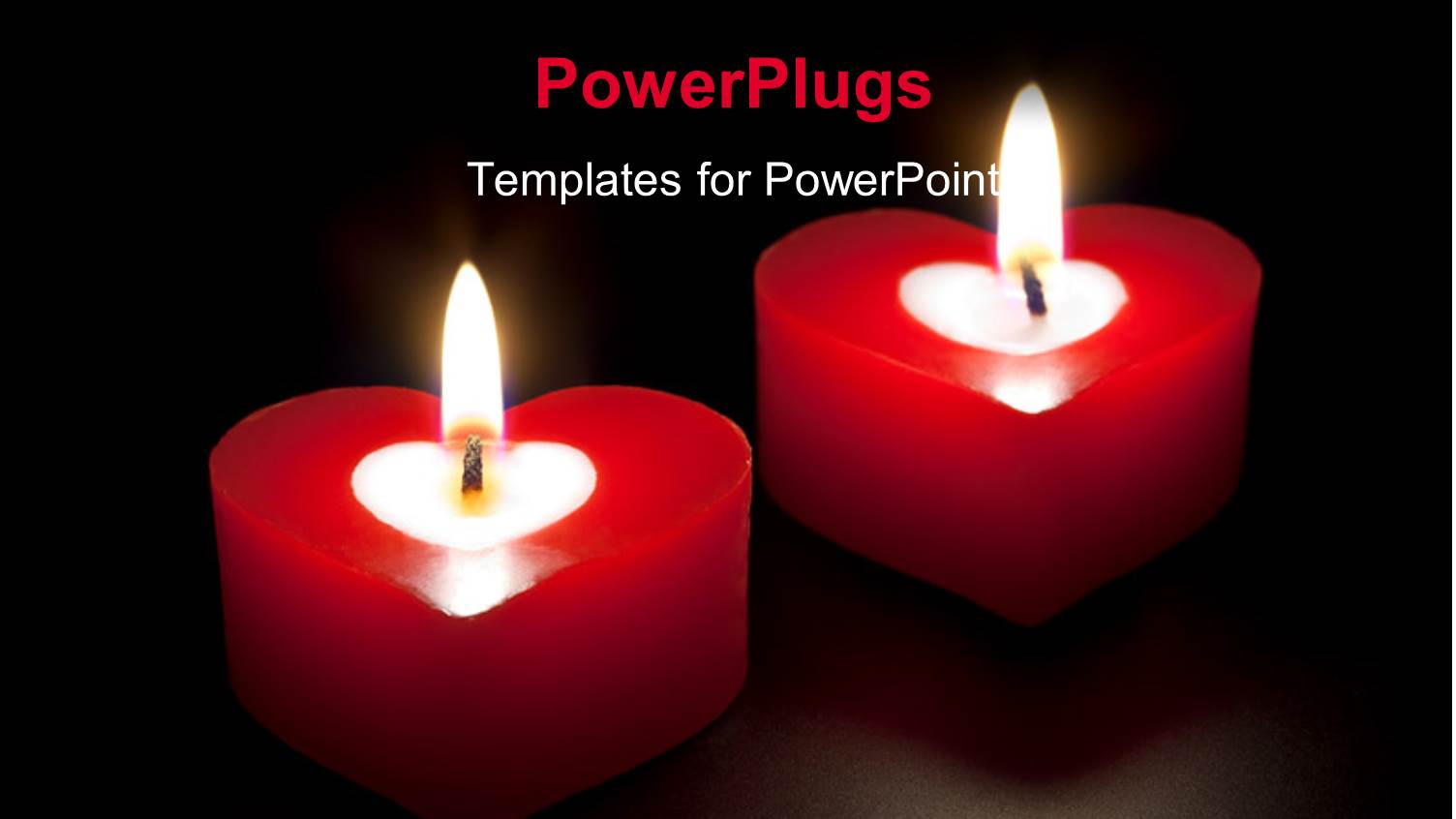 Two Lit Red Colored Heat Shaped Candles in the Dark