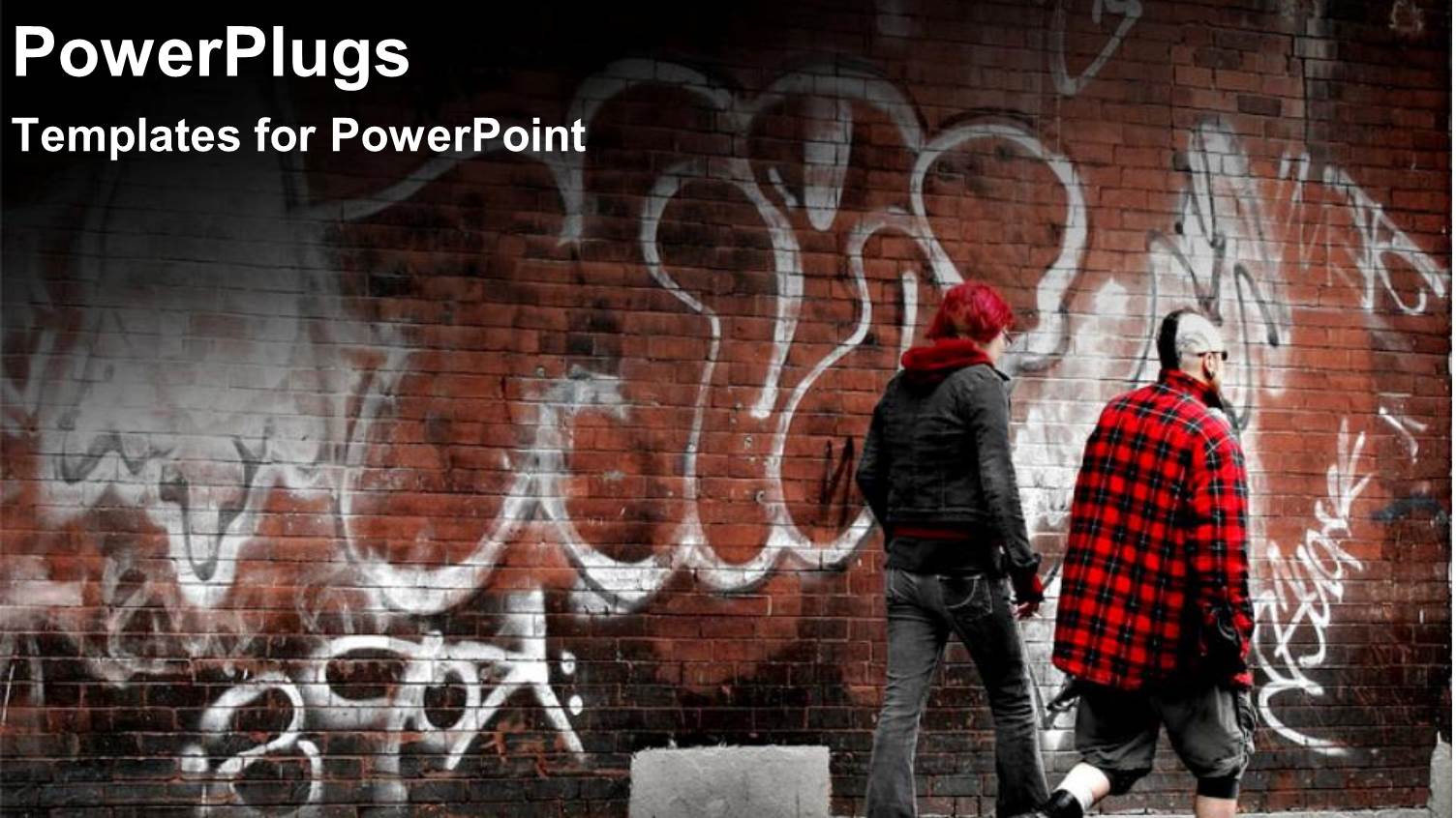 Two Men Walking Past a Brown Brick Wall with Drawings