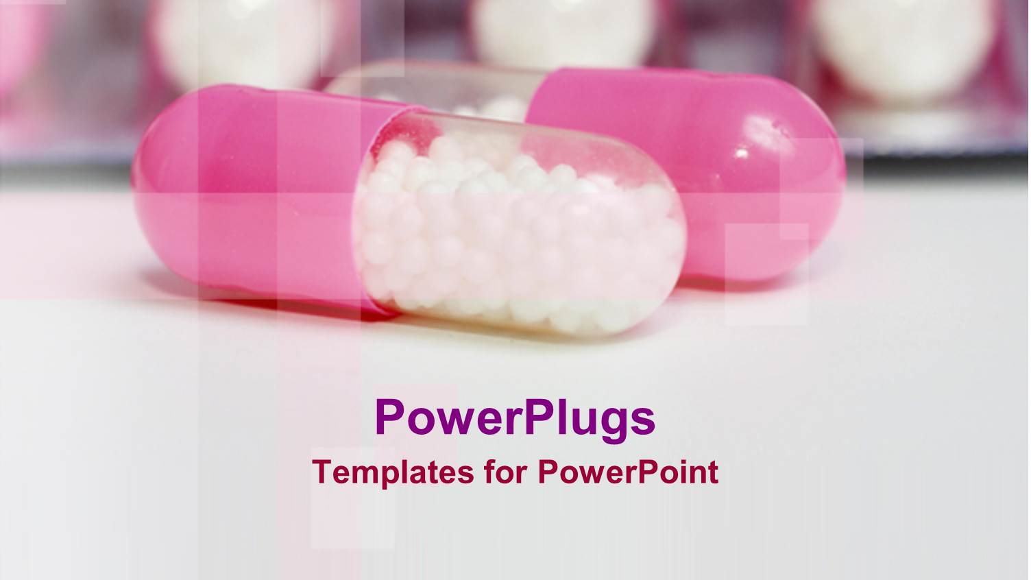 Two Pink and White Colored Capsules on a Blurry Background