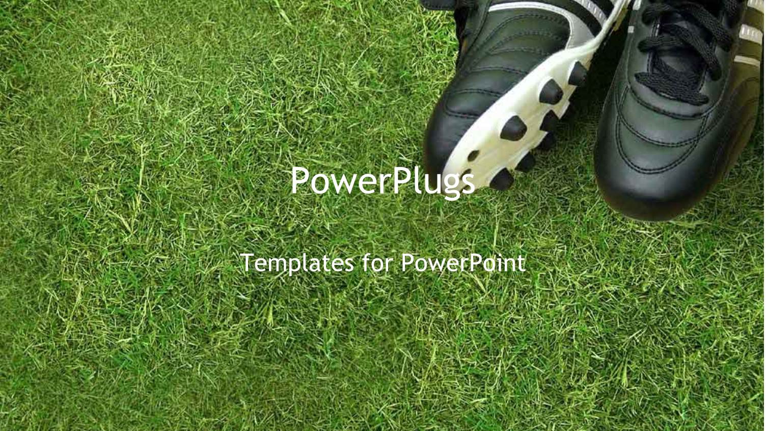 White and Black Colored Sport Boots with Spikes on Grass