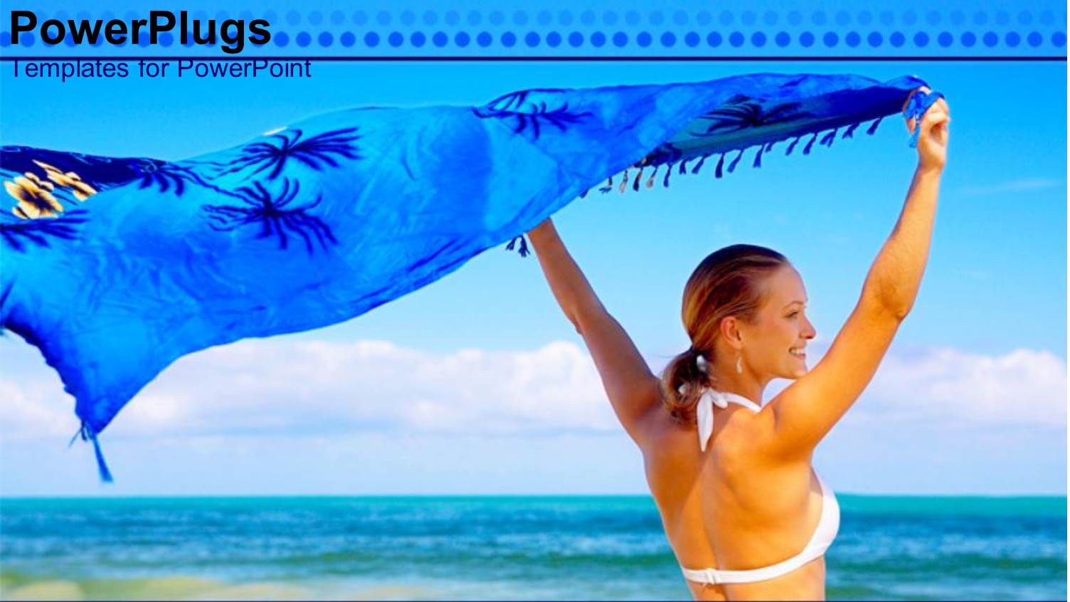 Woman Holding Blue Silk Wrap to Catch Breeze on Beach