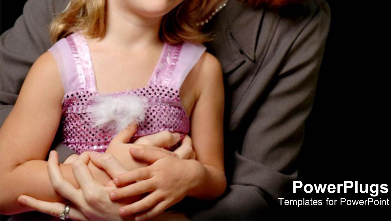 a Woman Wit a Young Girl Holding Hands on Black Background