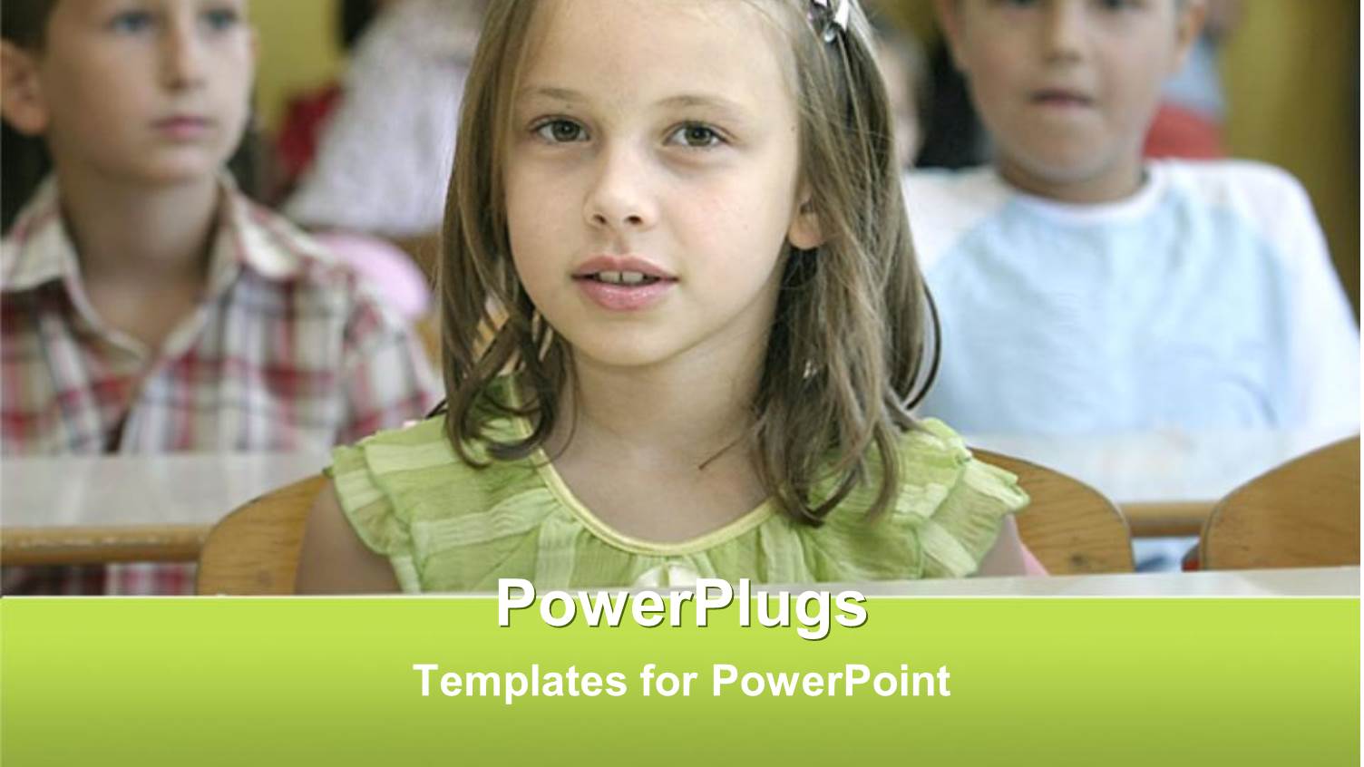 Young Pretty little Girl in Green in a Class Room