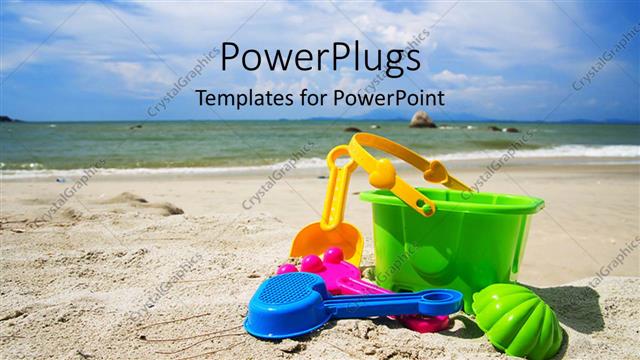  Presentation with spades - A bucket and spades on the beach with the sea in the background