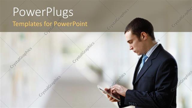  Presentation with touch screen - Businessman operating touch screen PDA device over blurry background