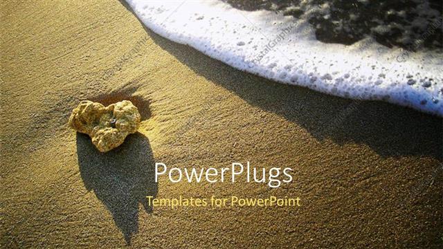  Presentation with ocean wave - Foamy ocean wave approaching sandstone pebble on beach sand