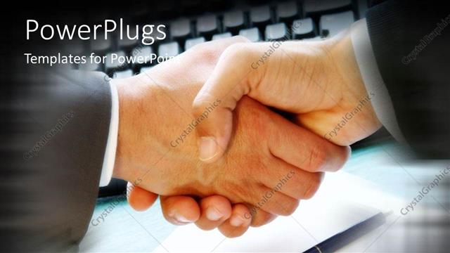  Presentation with pen - Handshake signifying business agreement with pen over paper and computer keyboard