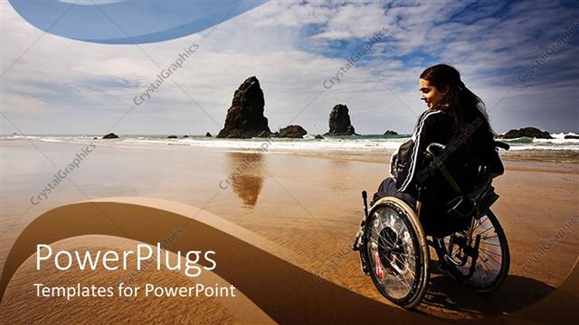  Presentation with adventure - Lady on wheelchair on brown beach close to the water