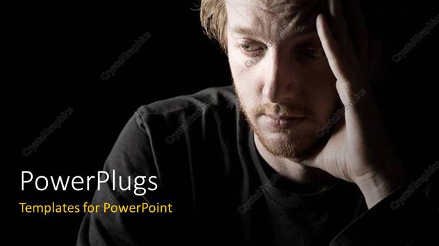  Presentation with depressed - Low key shot of a depressed red headed male with black color