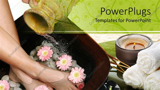  Presentation with spa - A pair of adult female legs in a footbath with flowers and pebbles