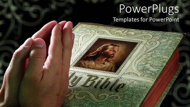  Presentation with pair - Pair of adult hands clasped together praying on a Bible