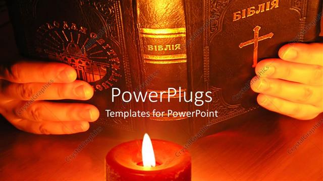  Presentation with hands holding - Pair hands holding old Bible in front of burning red candle