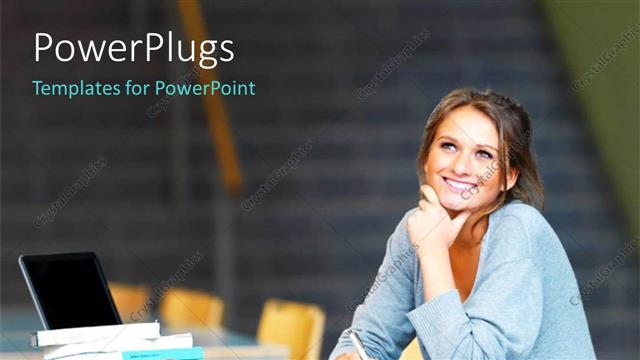  Presentation with laptop - A pretty female student smiling wiith an open laptop and books