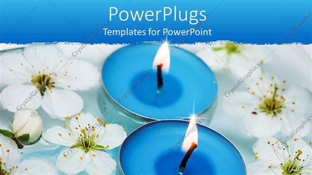  Presentation with lit candles - Two blue scented spa candles lit on water with white flowers