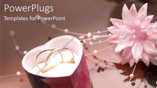 Presentation with flower wedding - Two wedding rings in a heart shaped jewelry gift box with wedding flower