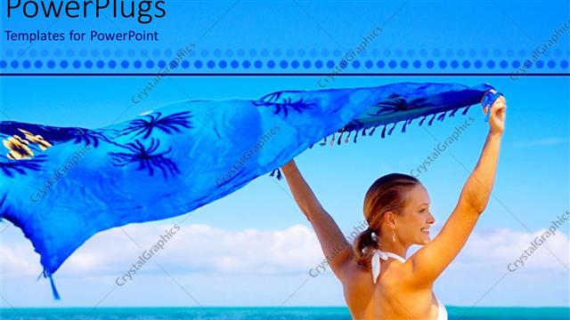  Presentation with vacation - Woman holding blue silk wrap to catch breeze on beach