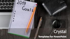  Presentation with new year 2019 - Slide deck having 2019 goals on his notebook background and a dark gray colored foreground