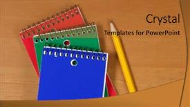  Presentation with note - Slide set having 3 ring binder - three note pads sitting background and a red colored foreground