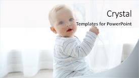  Presentation with baby sitting - Amazing PPT layouts having adorable baby boy sitting backdrop and a light gray colored foreground