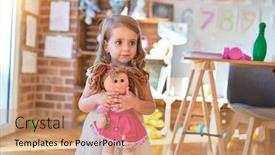  Presentation with doll - Audience pleasing theme consisting of adorable-blonde-toddler-hugigng-doll backdrop and a coral colored foreground