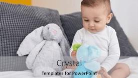  Presentation with baby toy - Slide deck having adorable-caucasian-baby-playing background and a light gray colored foreground