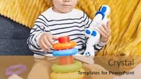  Presentation with robot toy - Presentation theme enhanced with adorable-caucasian-boy-playing background and a gold colored foreground