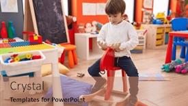  Presentation with kindergarten - PPT theme with adorable-caucasian-boy-playing background and a  colored foreground
