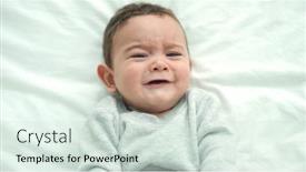  Presentation with crying baby - PPT theme having adorable-hispanic-baby-lying background and a soft green colored foreground