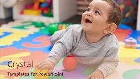  Presentation with infants and balls - PPT theme enhanced with adorable-hispanic-baby-playing background and a coral colored foreground