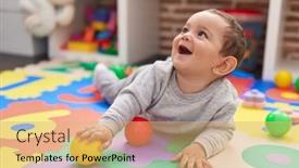  Presentation with christmas balls disco ball - PPT theme consisting of adorable-hispanic-baby-playing background and a coral colored foreground