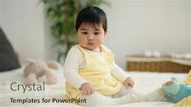  Presentation with doll - PPT theme enhanced with adorable-hispanic-baby-playing background and a soft green colored foreground