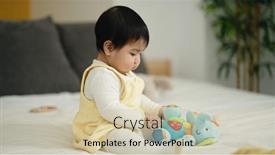  Presentation with doll - Theme consisting of adorable-hispanic-baby-playing background and a soft green colored foreground