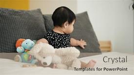  Presentation with baby sitting - PPT theme having adorable-hispanic-baby-playing background and a mint green colored foreground