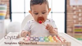  Presentation with xylophone - Slide set having adorable-hispanic-baby-sitting background and a soft green colored foreground