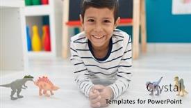  Presentation with kindergarten - Theme featuring adorable-hispanic-boy-playing background and a light gray colored foreground