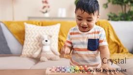  Presentation with xylophone - Slide set consisting of adorable-hispanic-toddler-playing-xylophone background and a coral colored foreground