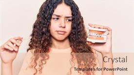  Presentation with denture - Cool new theme with adorable-latin-teenager-holding-denture backdrop and a coral colored foreground