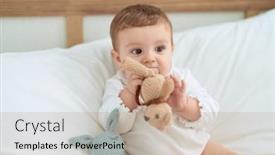  Presentation with doll - Slides having adorable-toddler-sitting-on-bed background and a coral colored foreground