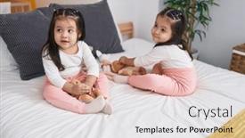  Presentation with baby sitting - PPT theme consisting of adorable-twin-girls-playing background and a white colored foreground