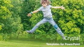  Presentation with school holidays - Cool new presentation theme with adorable young child boy in the park on warm summer day during school holidays kid boy jumping and smiling backdrop and a tawny brown colored foreground