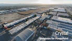  Presentation with late - Audience pleasing PPT layouts consisting of aerial view of industrial building backdrop and a ocean colored foreground