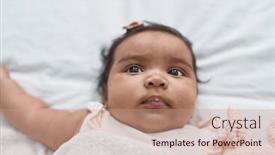  Presentation with african american baby - PPT theme having african-american-baby-lying background and a coral colored foreground