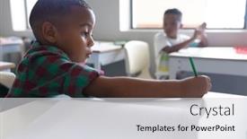  Presentation with school elementary - Theme featuring african-american-elementary-schoolboy-writing background and a light gray colored foreground