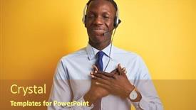 Presentation with chest - Presentation theme featuring african american operator man working using headset over isolated yellow background smiling with hands on chest with closed eyes and grateful gesture on face health concept background and a tawny brown colored foreground