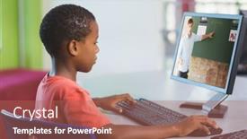  Presentation with lockdown - Amazing PPT layouts having african-american-schoolboy-using-computer backdrop and a coral colored foreground