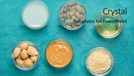  Presentation with nuts milk - Beautiful PPT theme featuring almond super foods nuts backdrop and a teal colored foreground